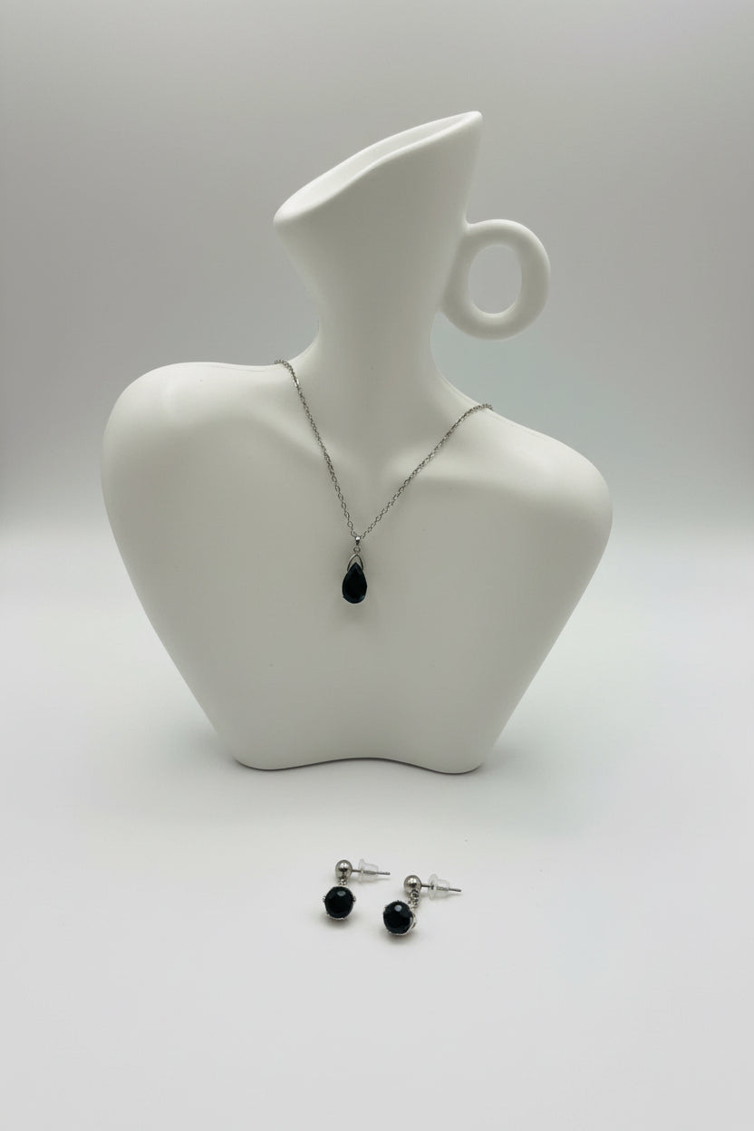 Jewelry set with necklace and earrings on a mannequin bust.