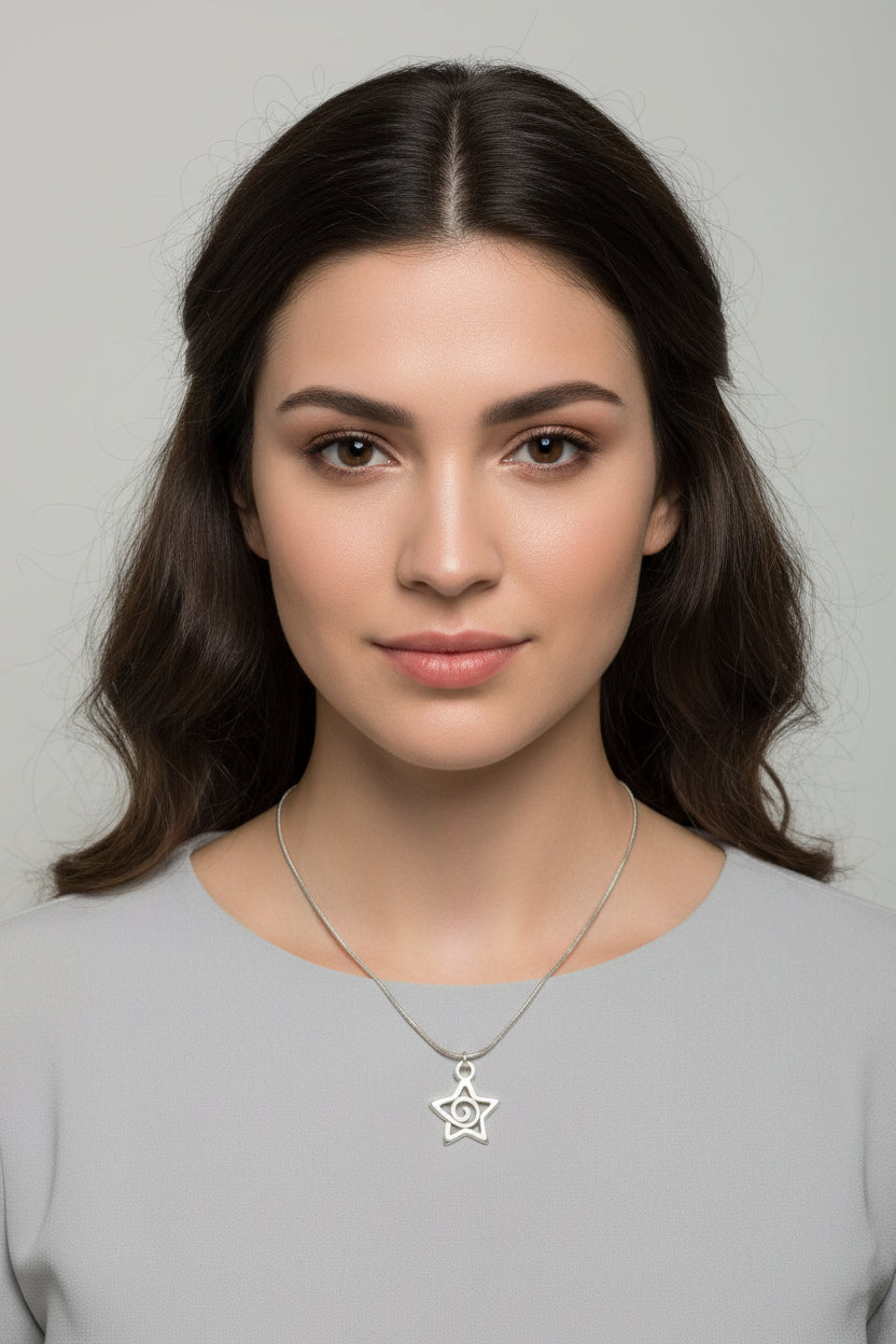 Silver star-shaped pendant necklace on a model