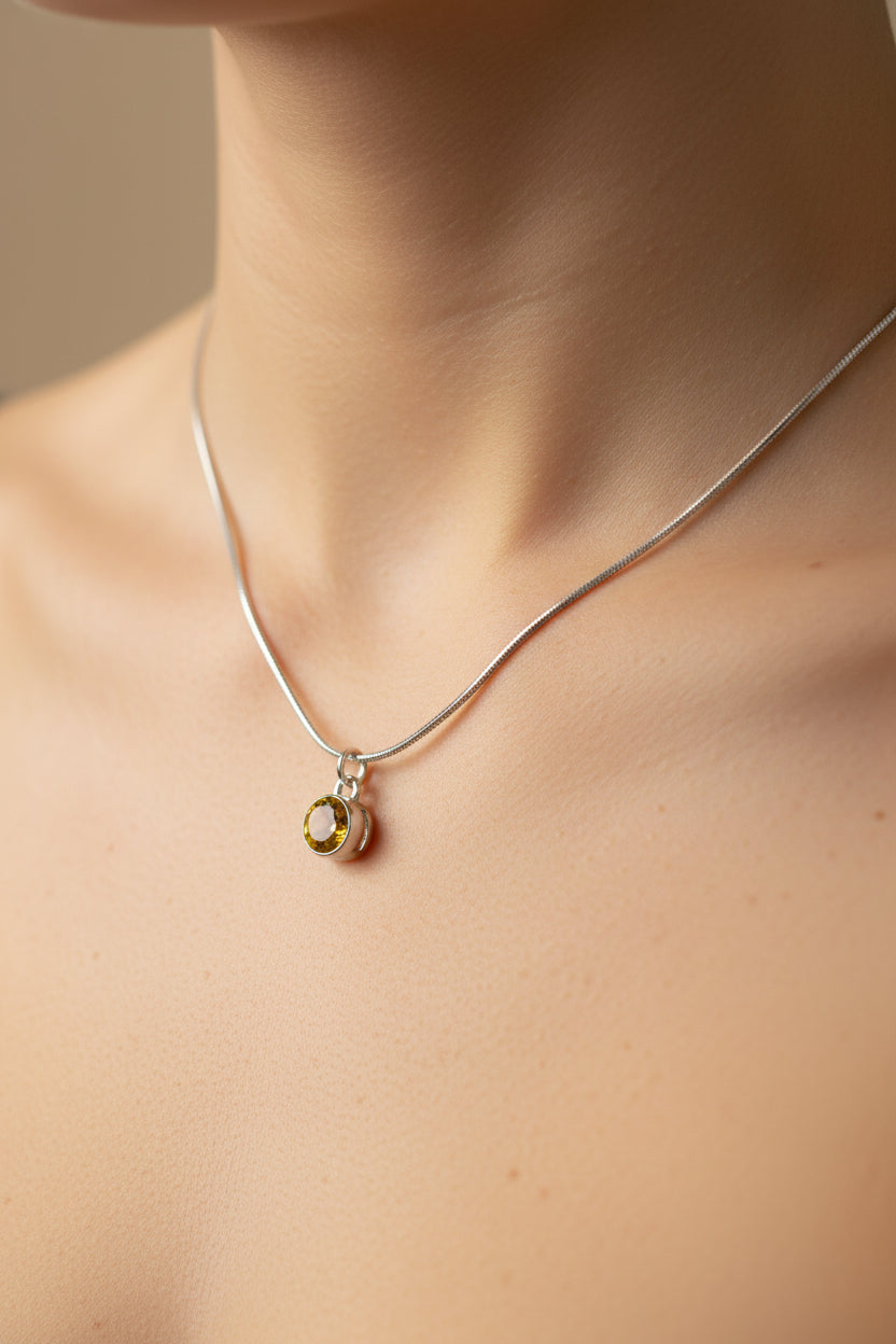 Necklace with a gemstone pendant on a model