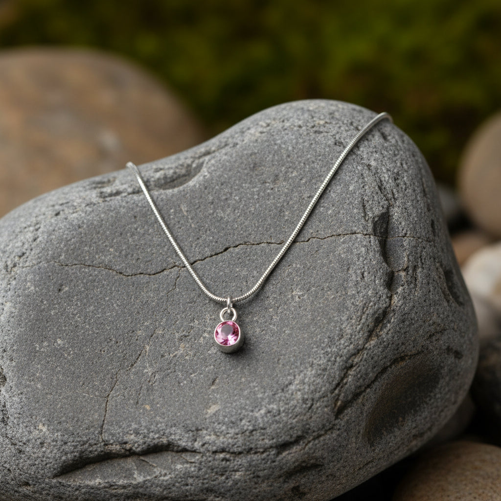 Necklace with a pink pendant on a large grey stone