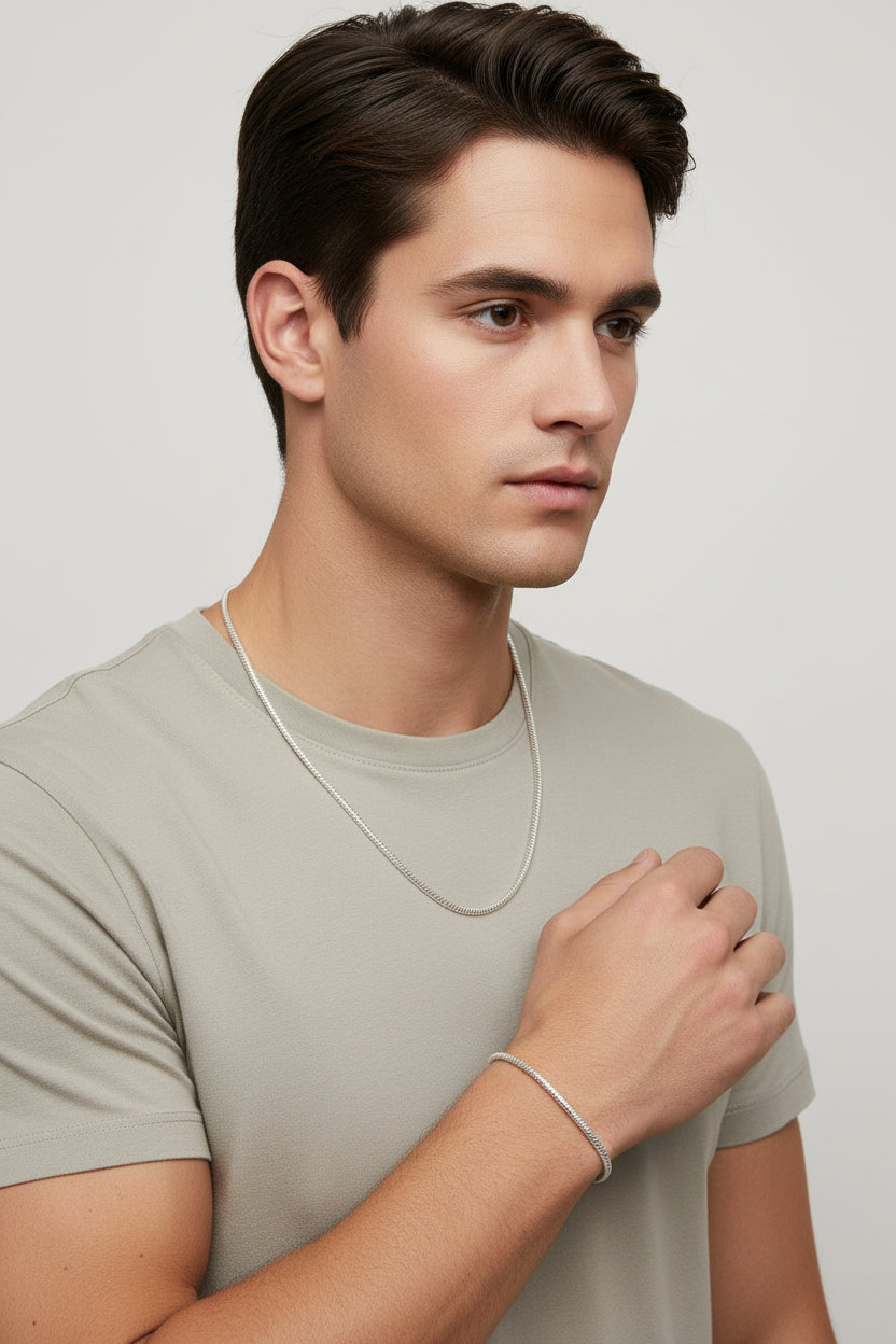 Silver necklace and bracelet on a male model