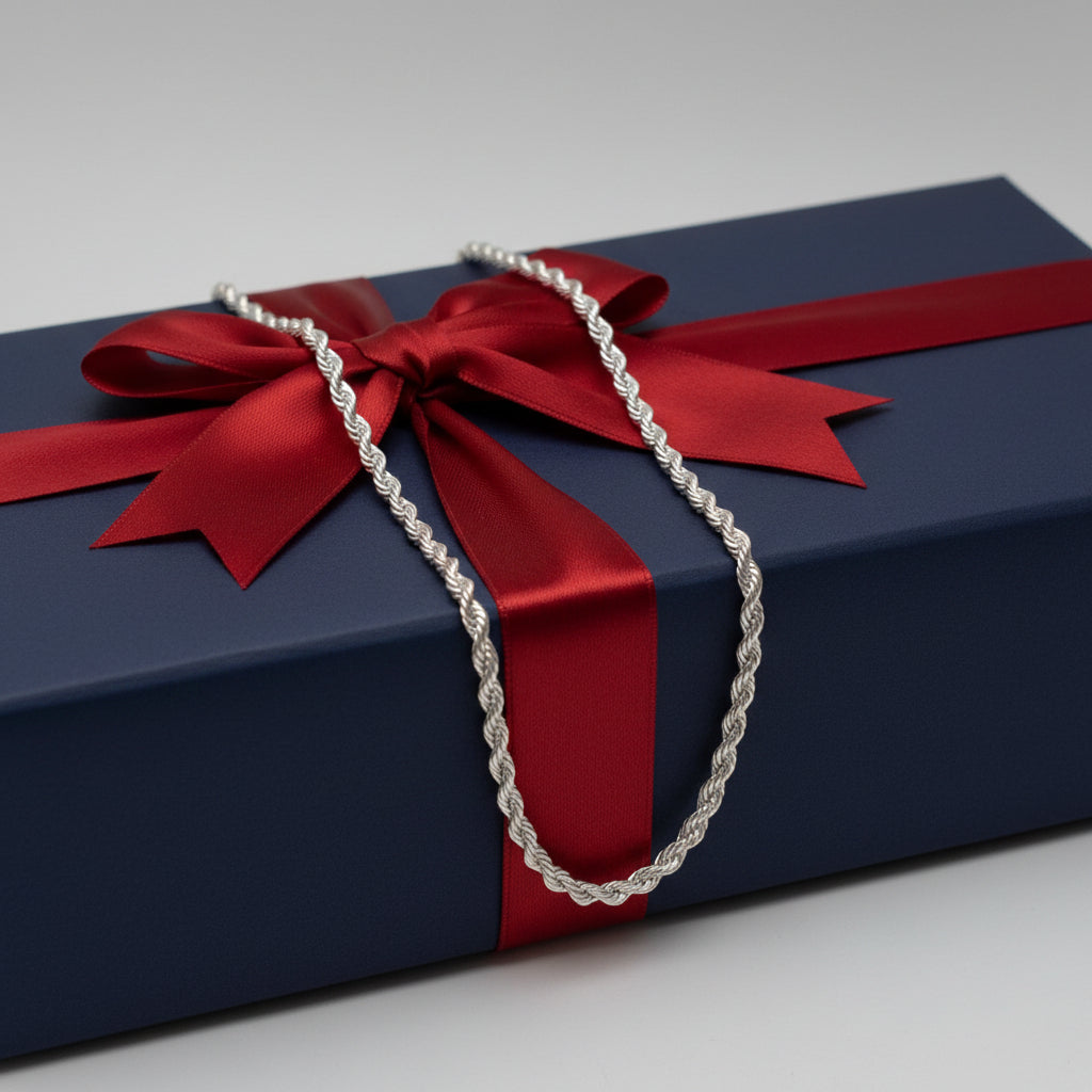 Silver rope chain necklace on a a gift box