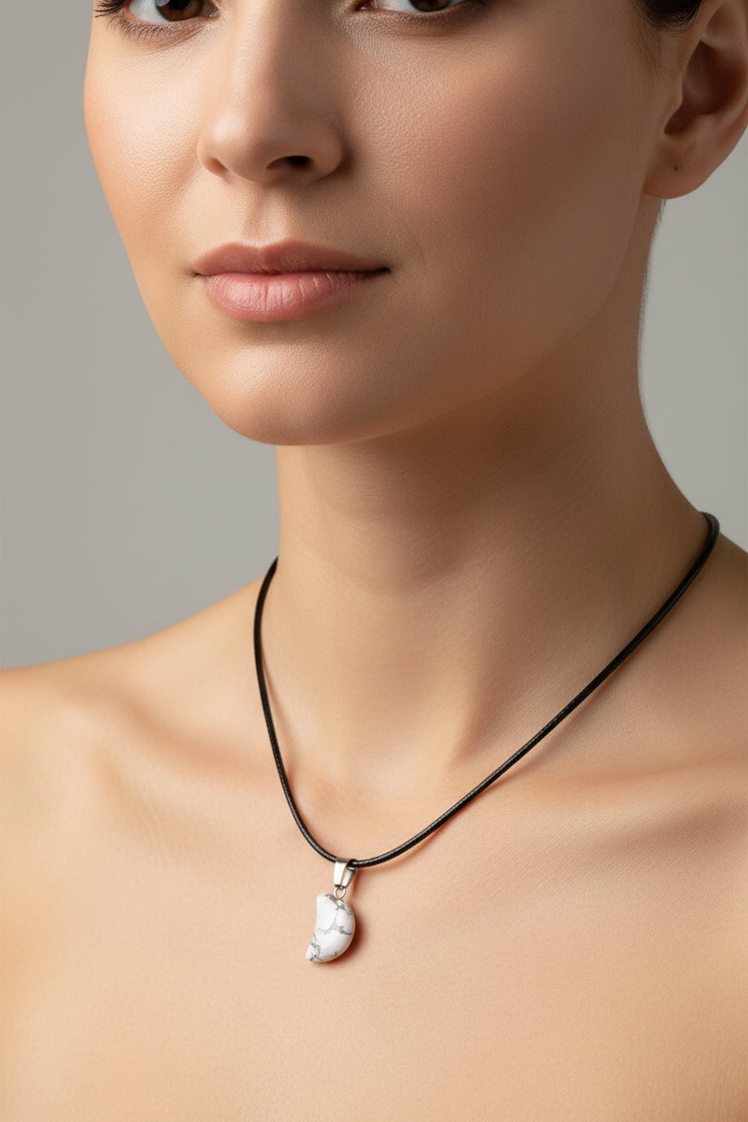 Necklace with a white stone pendant on a model