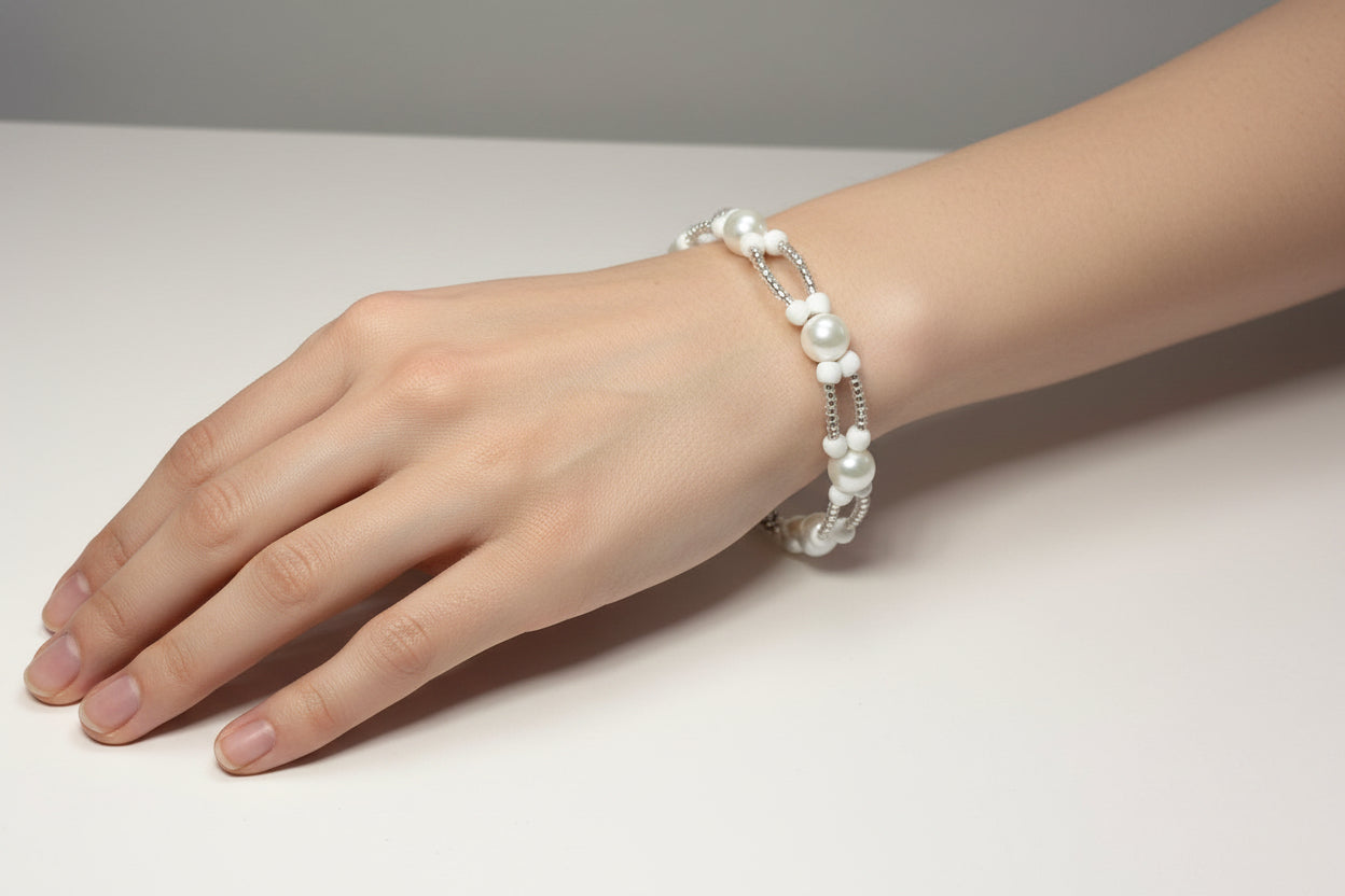 Handmade elasticated double strand bracelet in white glass pearl by Majestic Gems by Sarah