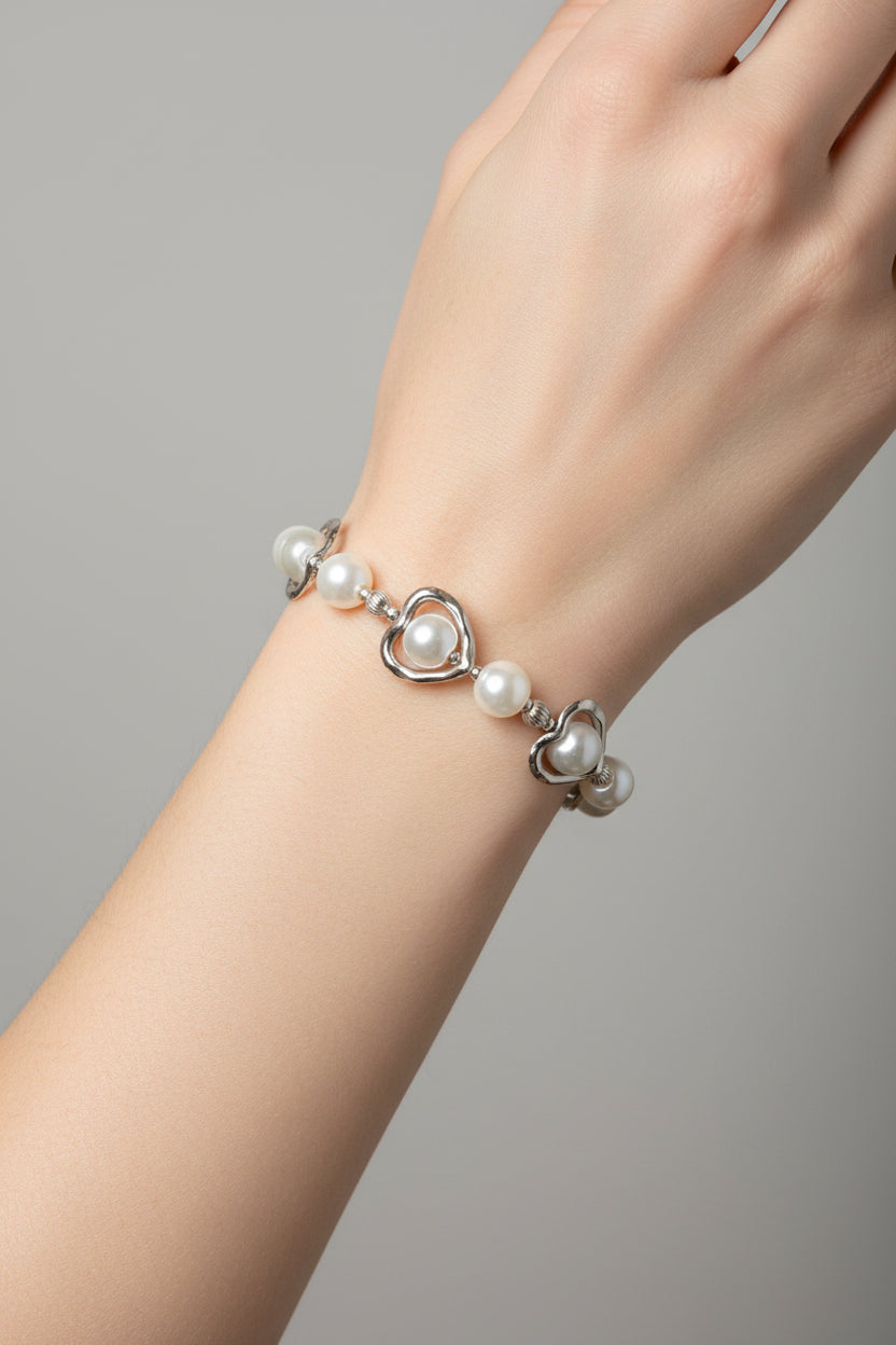 White pearl bracelet on a models arm